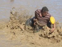 Up to the Armpits in it - The Mud Footy Challenge